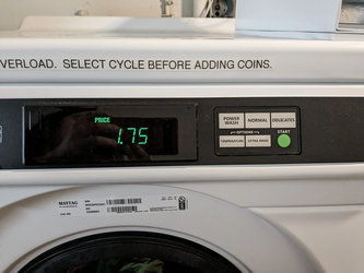 A washing machine with a display of the cost