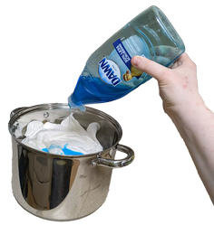 A hand pouring soap into a pot filled with white cloth diapers