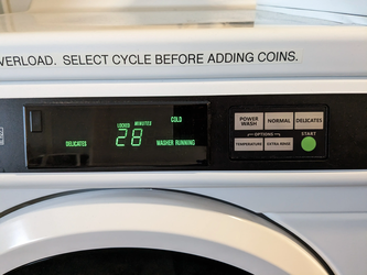 A washing machine with a display of the time