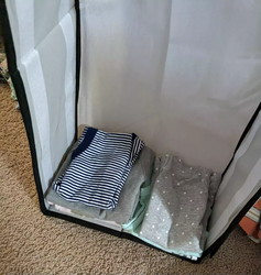 A folded onesie inside the organizer